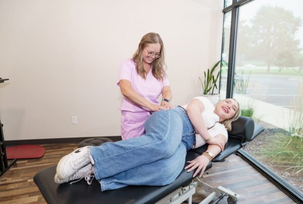 Dr. Brittany Dempsey treating a patient's low back at CMR Health Group in Yorkville, IL