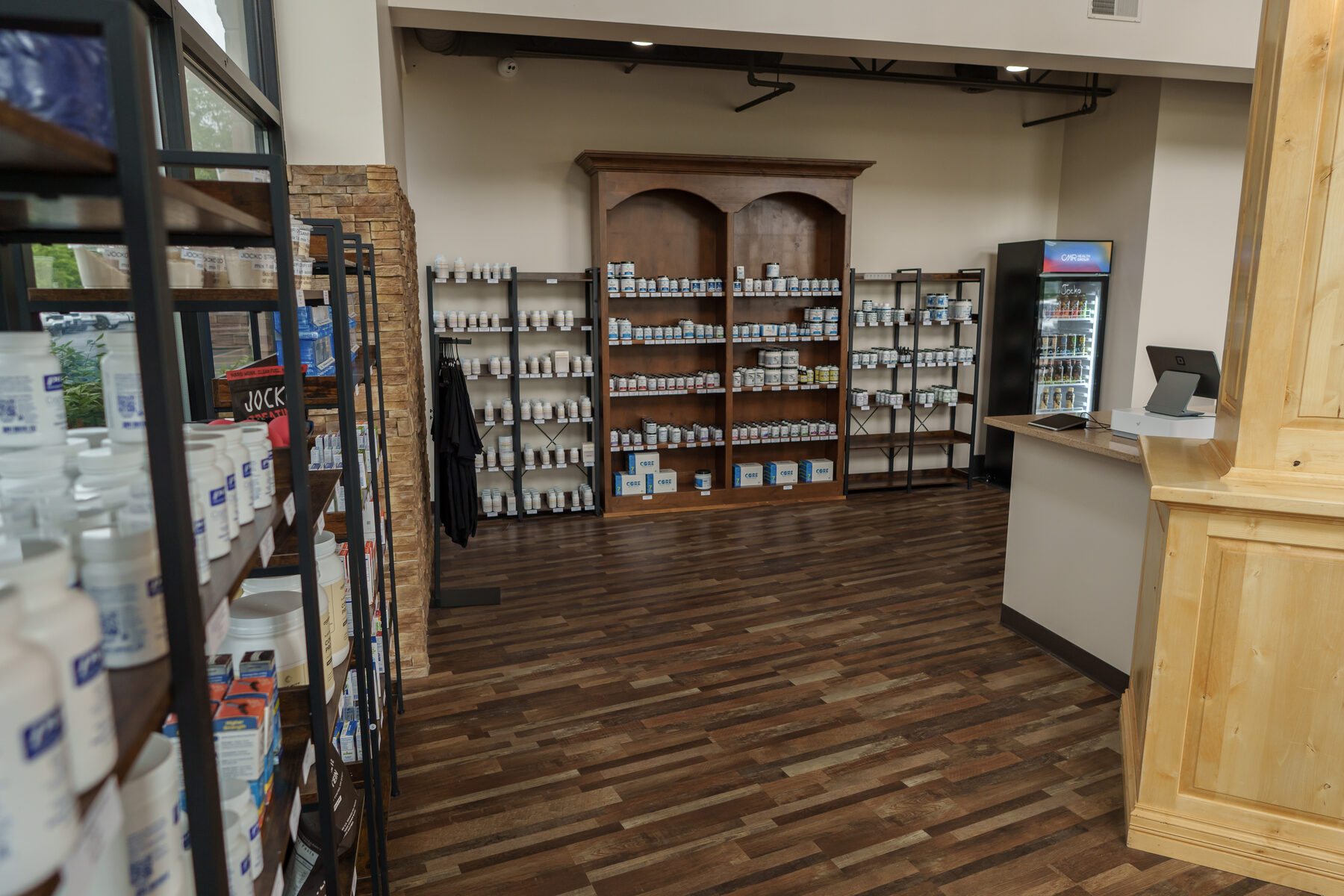 Interior of the CMR Health Group supplement store in Yorkville, IL, with stocked shelves and a checkout counter