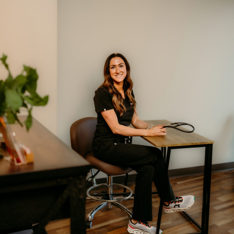 Kelsey, nurse practitioner at CMR Health Group in Yorkville, IL, seated in a consult room